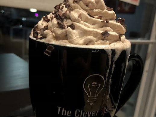 Clever Beans Royal Hot Chocolate, topped with smooth whipped cream and sweet chocolate shavings.