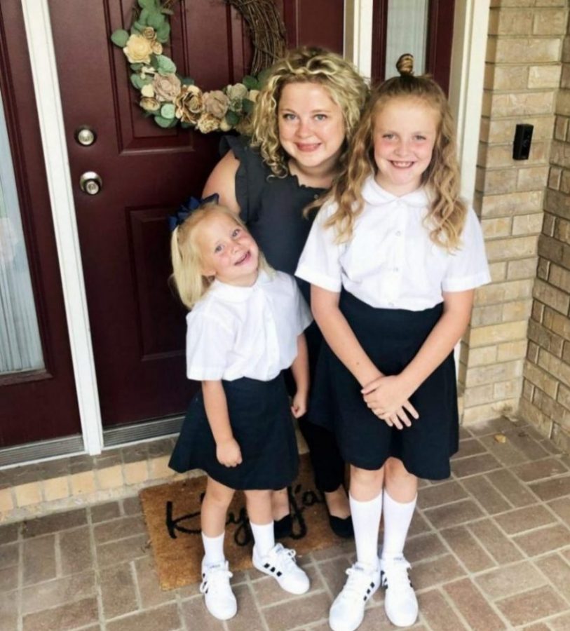 This is Mrs. Ashmore & her two daughters taken on their first day of school.