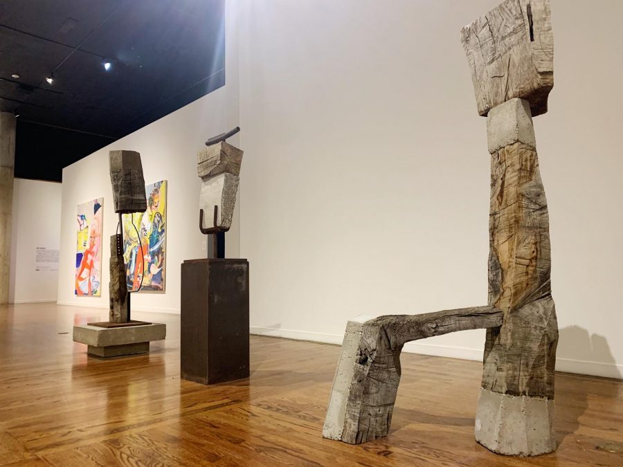 A series of sculptures in the middle of the gallery, showcasing abstract art.