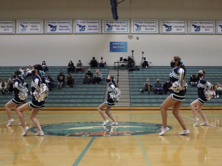The cheer team performing their halftime performance at the Ogden basketball game. 