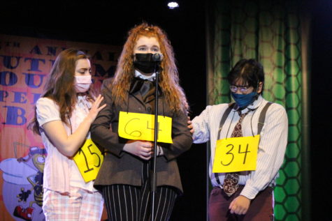 Olivia Thomas is comforted by Kaitlyn Woods and David Kale in a performance of The 25th Annual Putnam County Spelling Bee